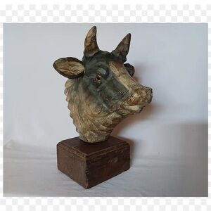Vintage hand carved wooden cow sculpture.